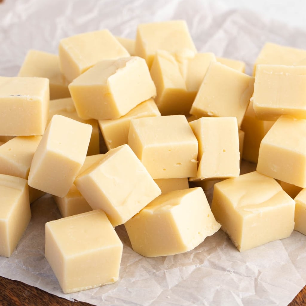 Sweet and Chocolatey White Chocolate Fudge Cubes on a Parchment Paper