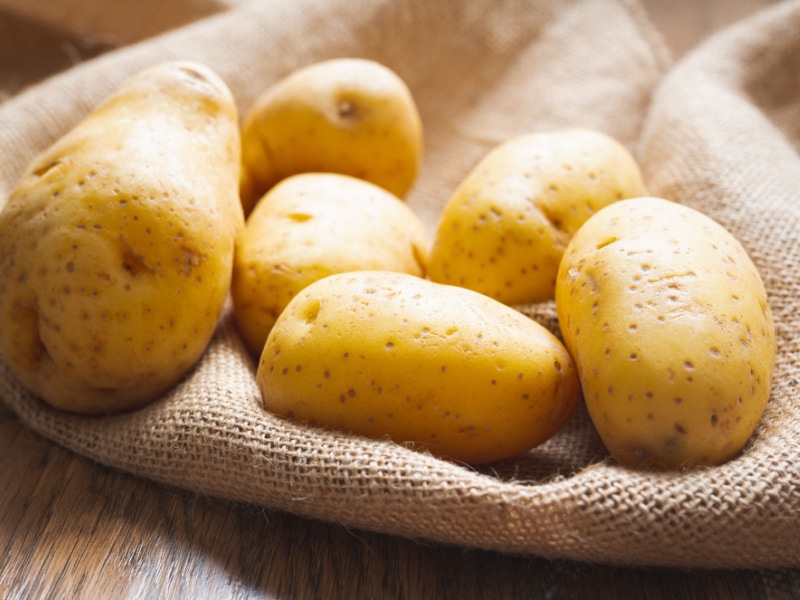 Yukon Gold Potatoes on Top of a Cloth Sack