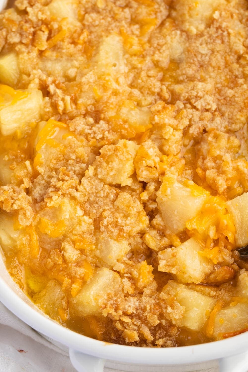 Top View Pineapple Casserole with Melted Cheese on Top