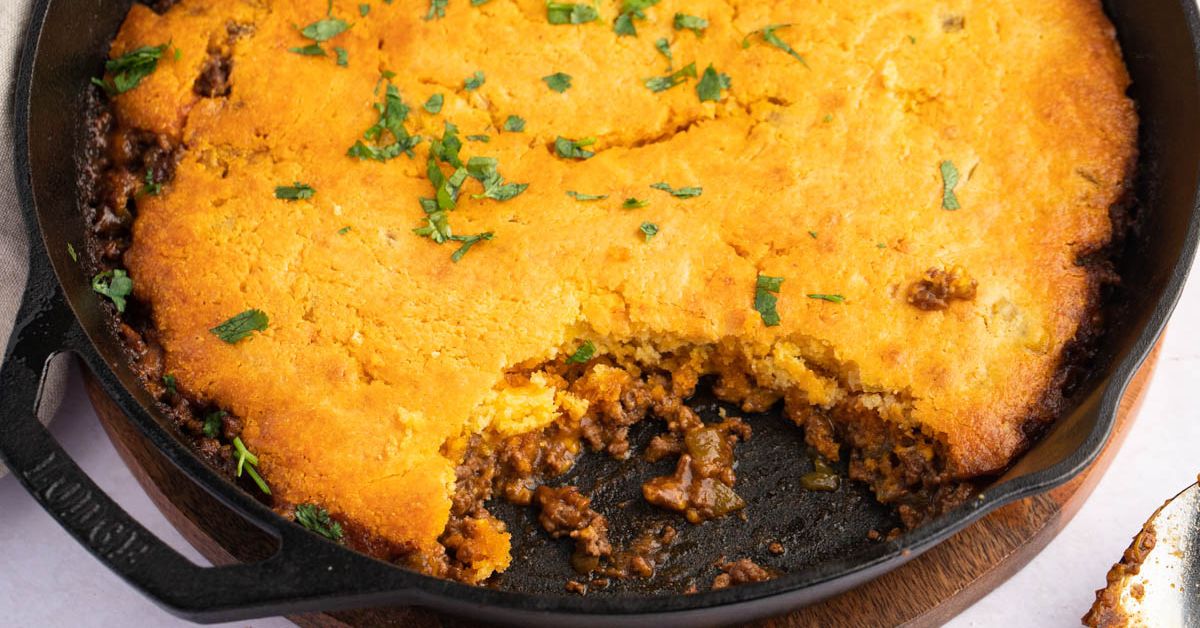 Homemade Tamale Pie with Ground Beef in a Black Skillet