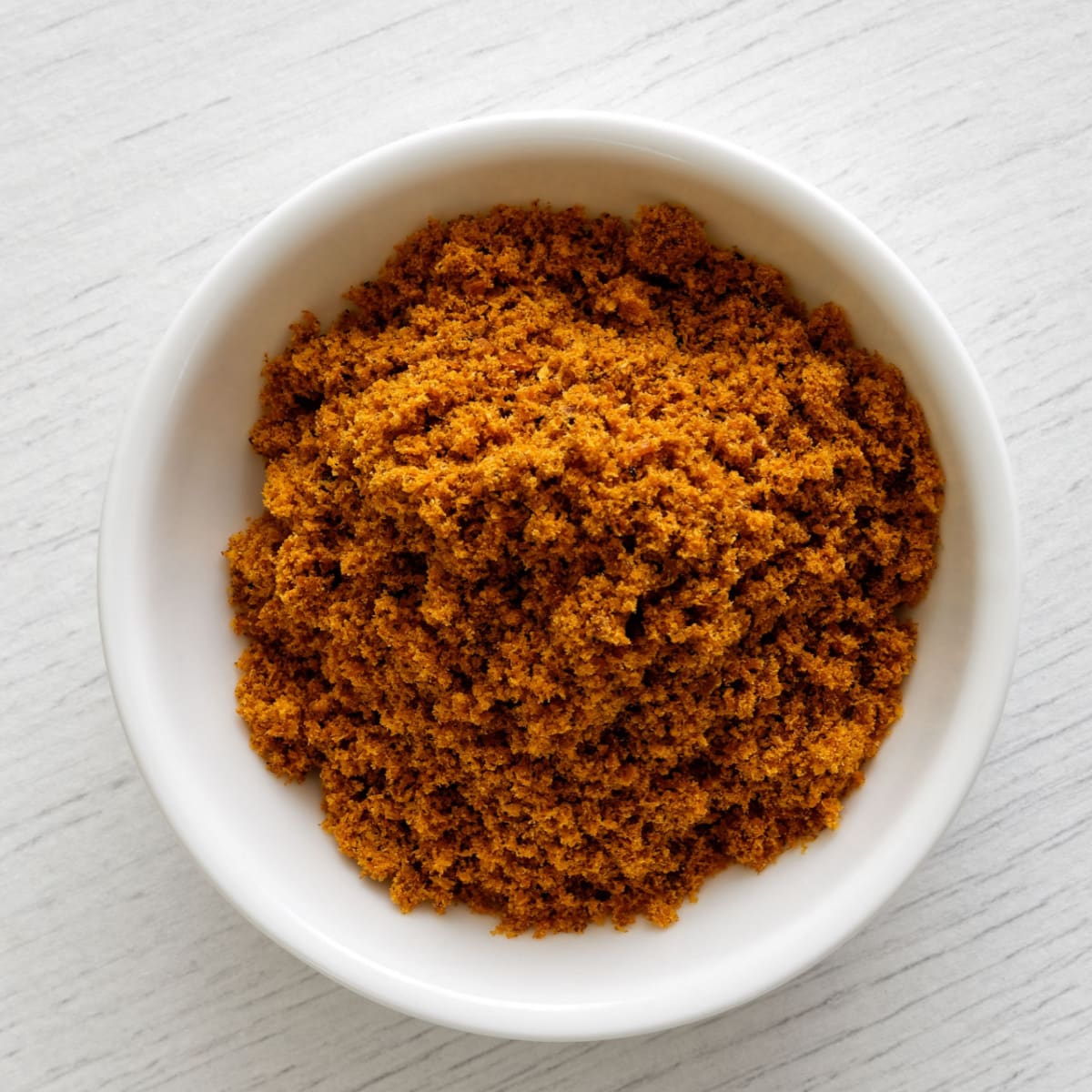 Powdered Mace in a White Ceramic Bowl