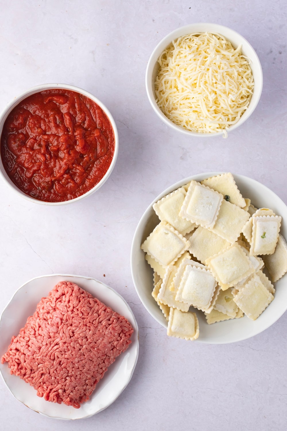 Ravioli Lasagna Ingredients - Ground Beef, Spaghetti Sauce, Ravioli, Mozzarella and Basil