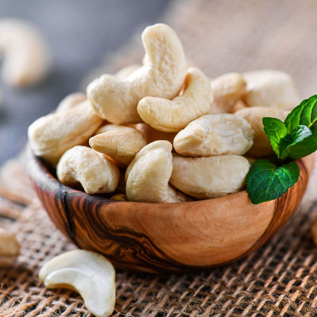 Heap of Cashews in a Wooden Bowl