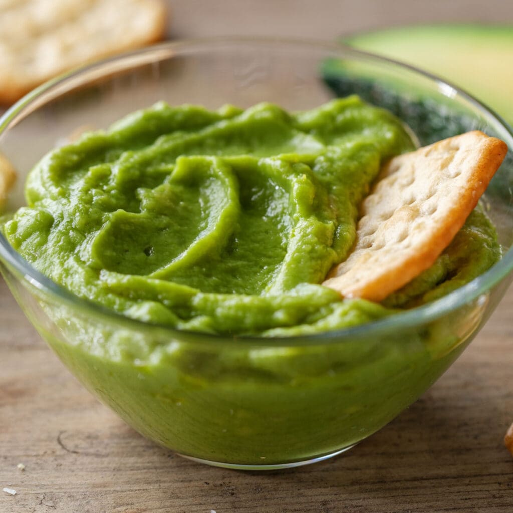 Mashed Avocado with Pita on a Clear Bowl