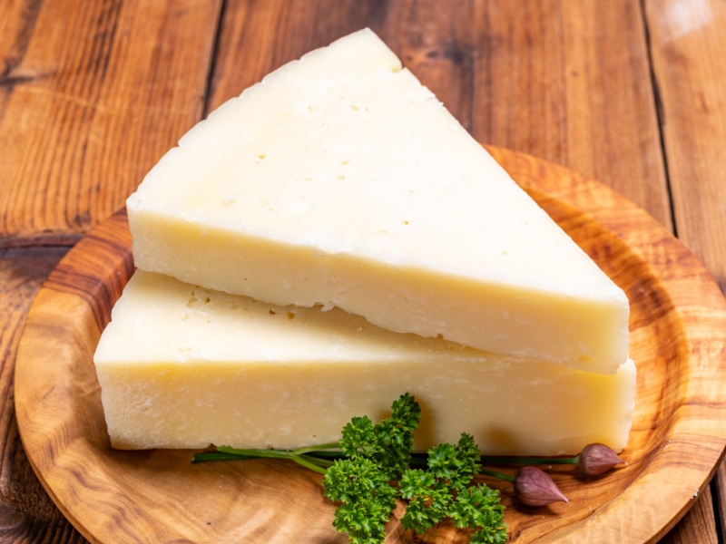 Pecorino Cheese Triangles on a Wooden Plate