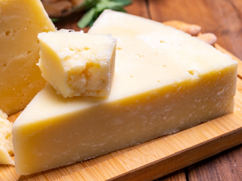 Chunks of Pecorino on a Wooden Cutting Board