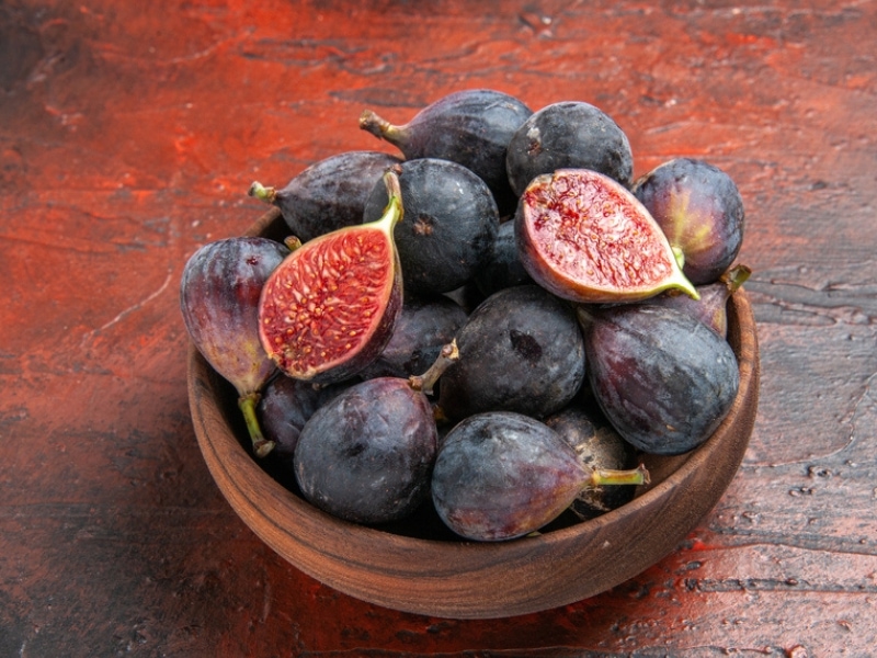 Fresh Black Mission Figs on a Wood Bowl