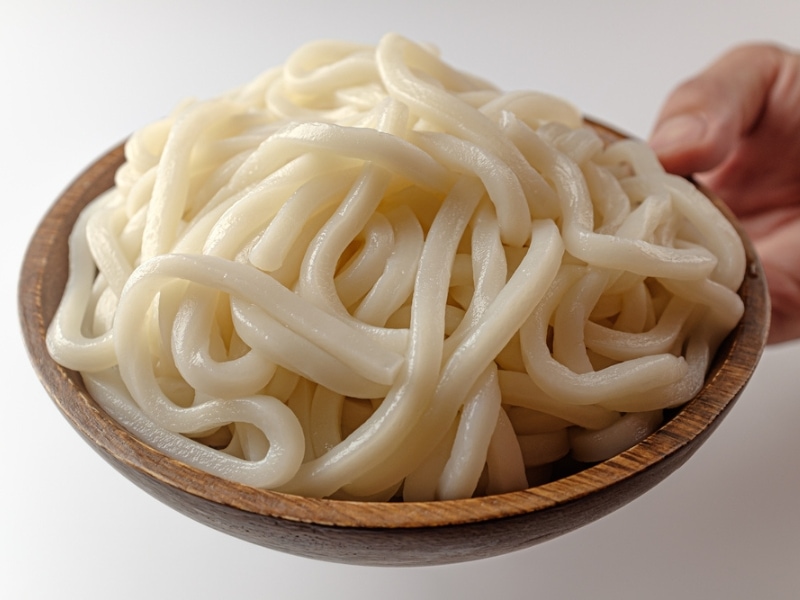 Cooked Udon Noodles in a Wooden Bowl