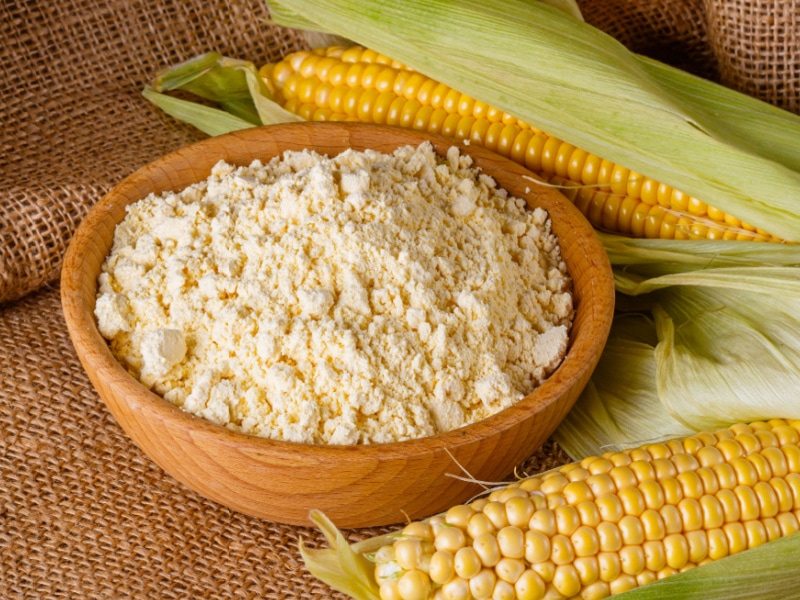 A Bowl of Corn Flour and Corn on a Burlap