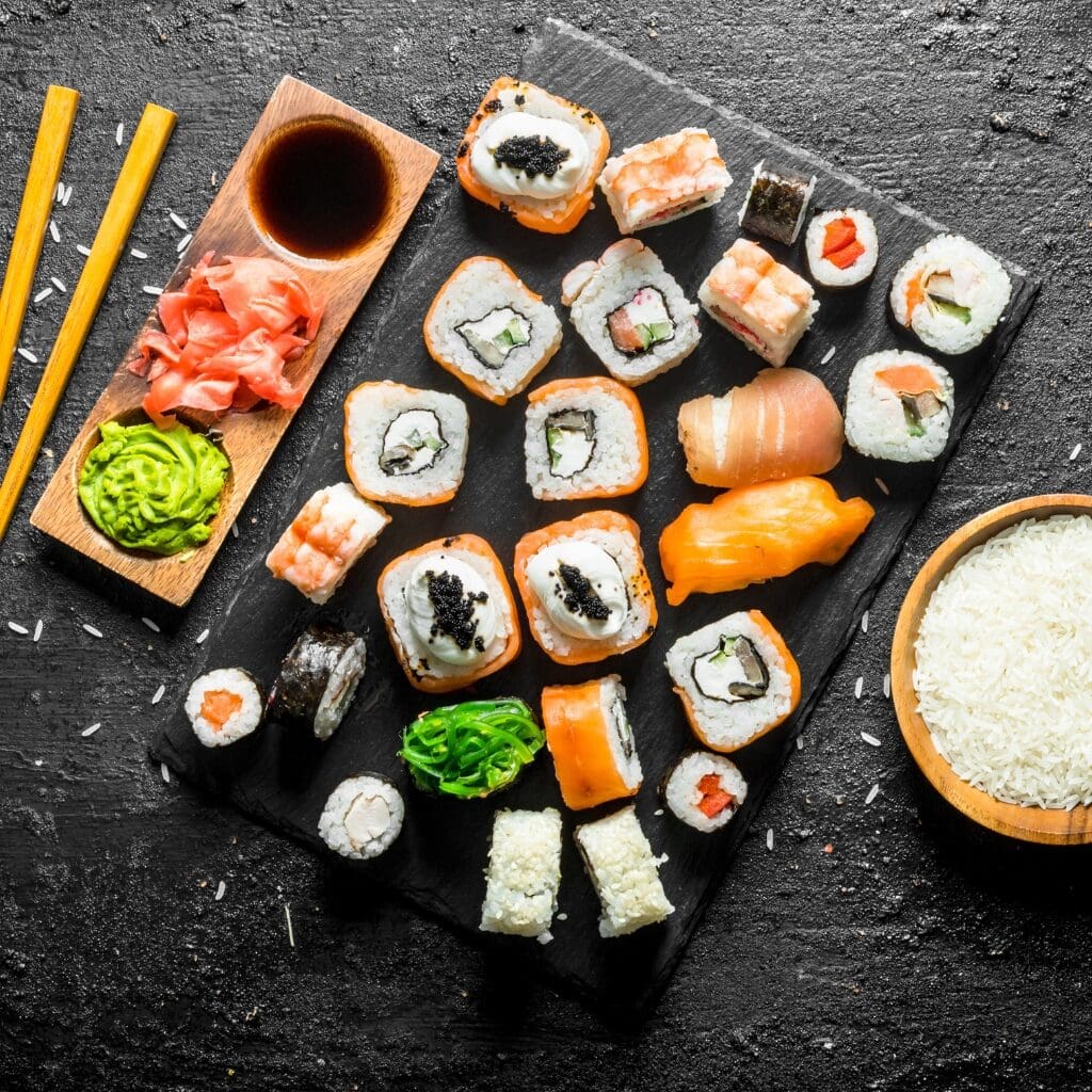 The Most Common Types of Sushi Explained featuring Different Types of Sushi Including Maki, Nigiri with Dipping Sauce