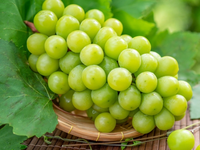 Bunch of Green Grapes on a Bamboo Tray