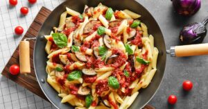 Homemade Macaroni Pasta with Eggplant, Tomato Sauce and Basil