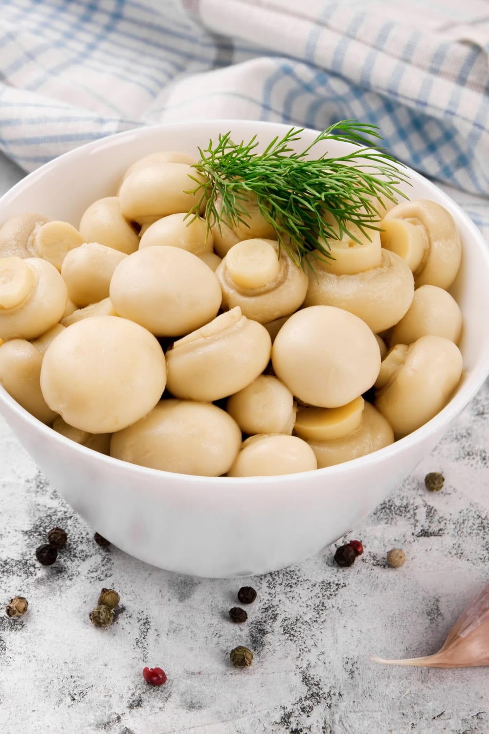 Pickled Mushrooms in a White Bowl with Spices