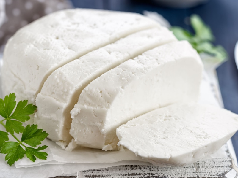 Queso Blanco Sliced on a Wooden Board