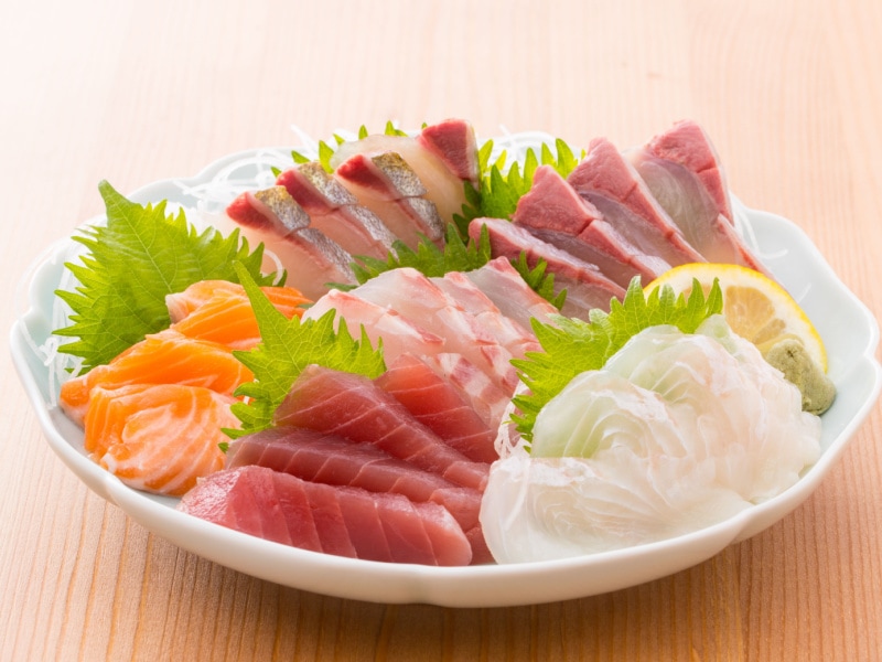 Assorted Fresh Sashimi on a Round White Plate