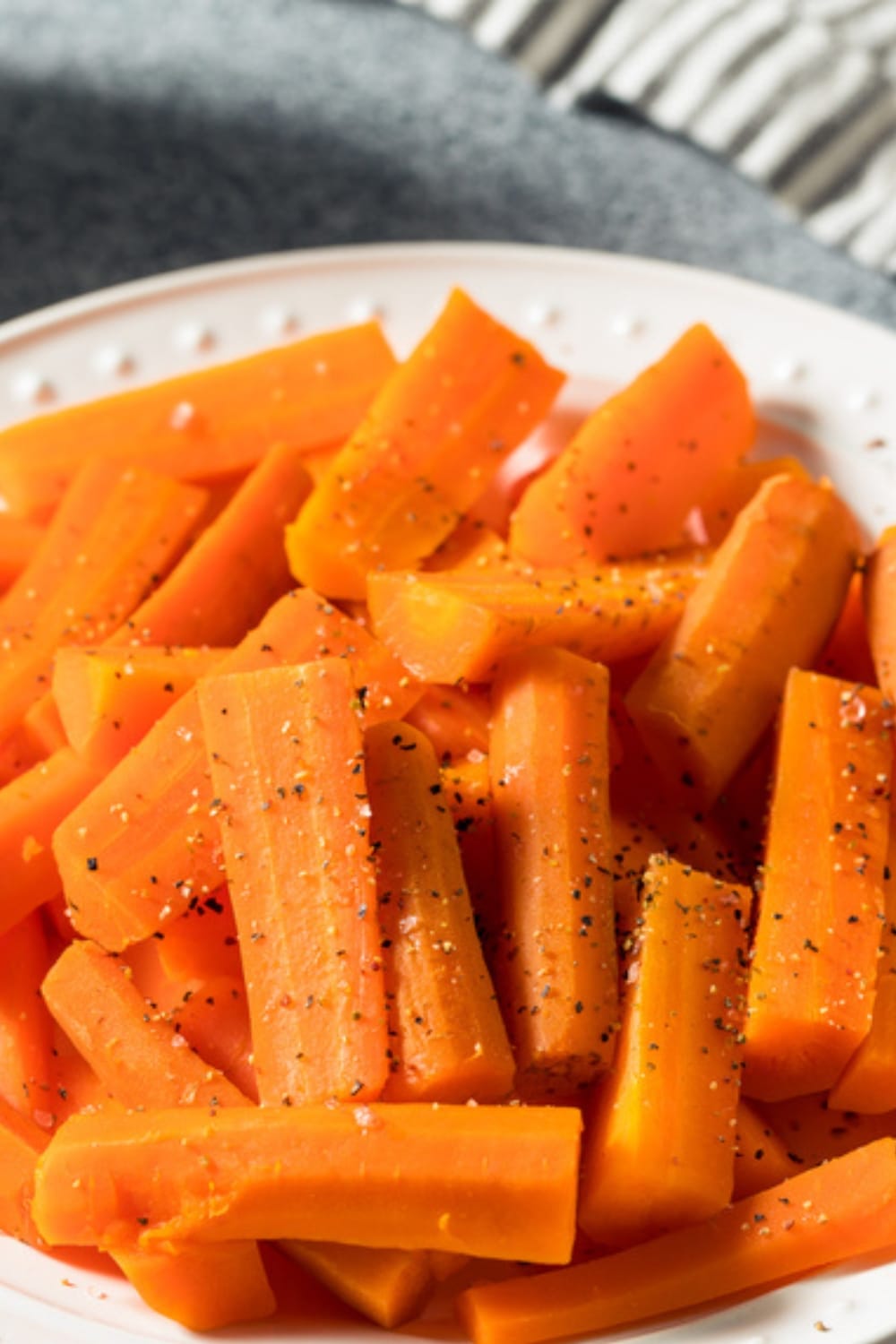 How to Steam Carrots in the Microwave featuring Steamed Carrots Sticks Seasoned With Salt and Pepper