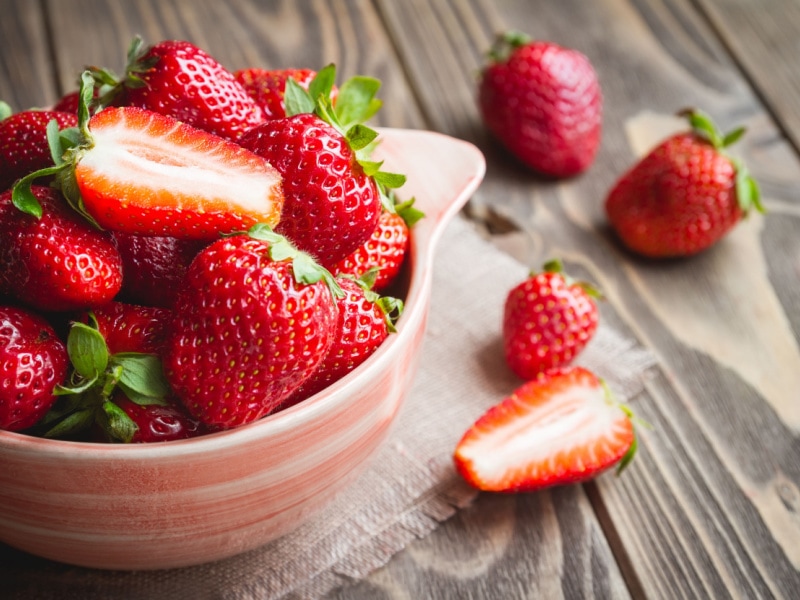 Bowl Full of Ripe Strawberries on a Wooden Table