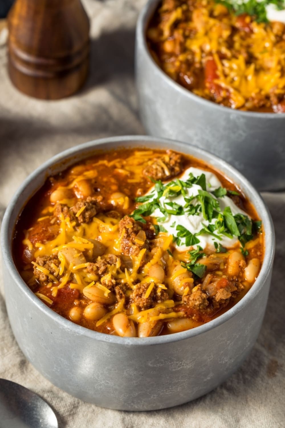 Bowl of Cheesy Turkey Chili With Sour Cream