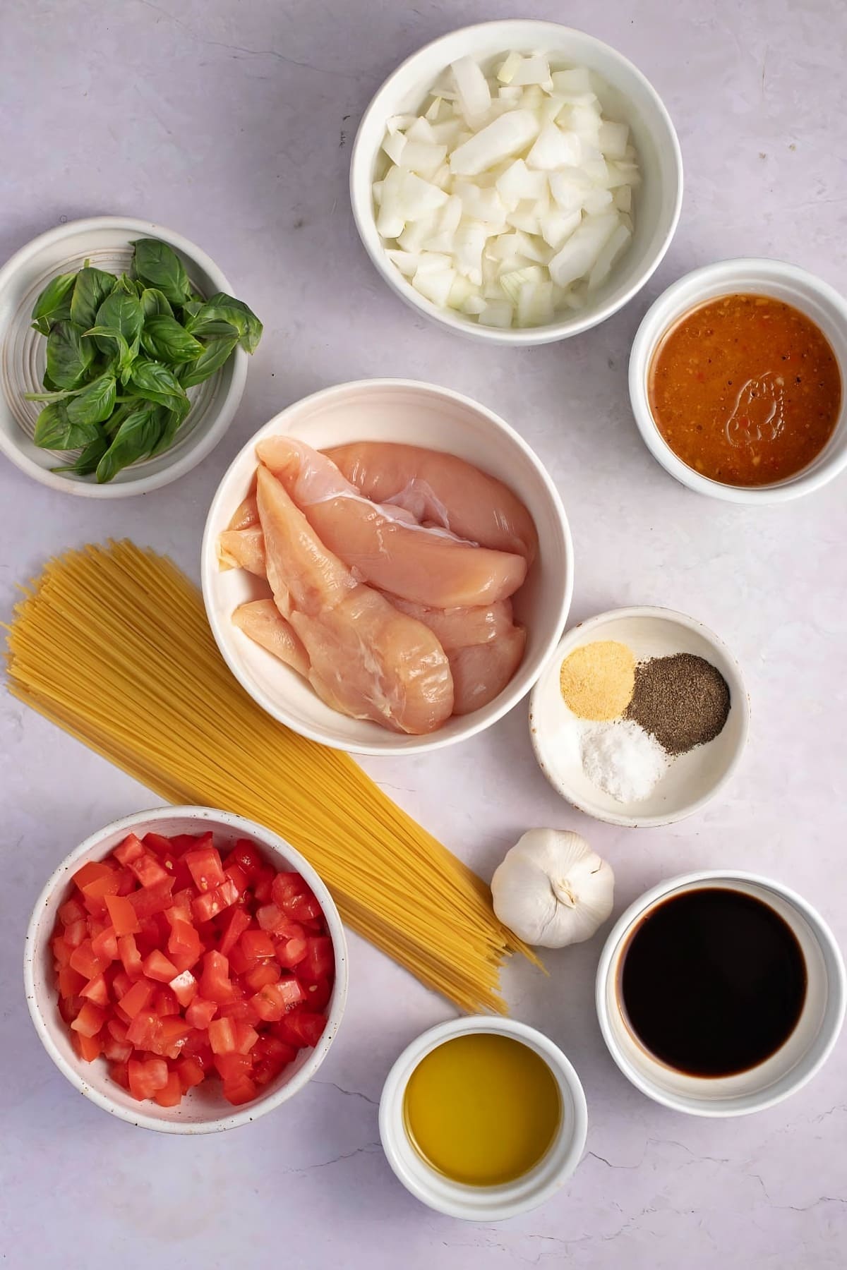 Bruschetta Chicken Pasta Ingredients - Chicken Breasts, Italian Salad Dressing, Seasonings, Rama Tomatoes, Basil, Garlic, Salt and Black Pepper, Vegetable Oil, Angel Hair Pasta and Olive Oil