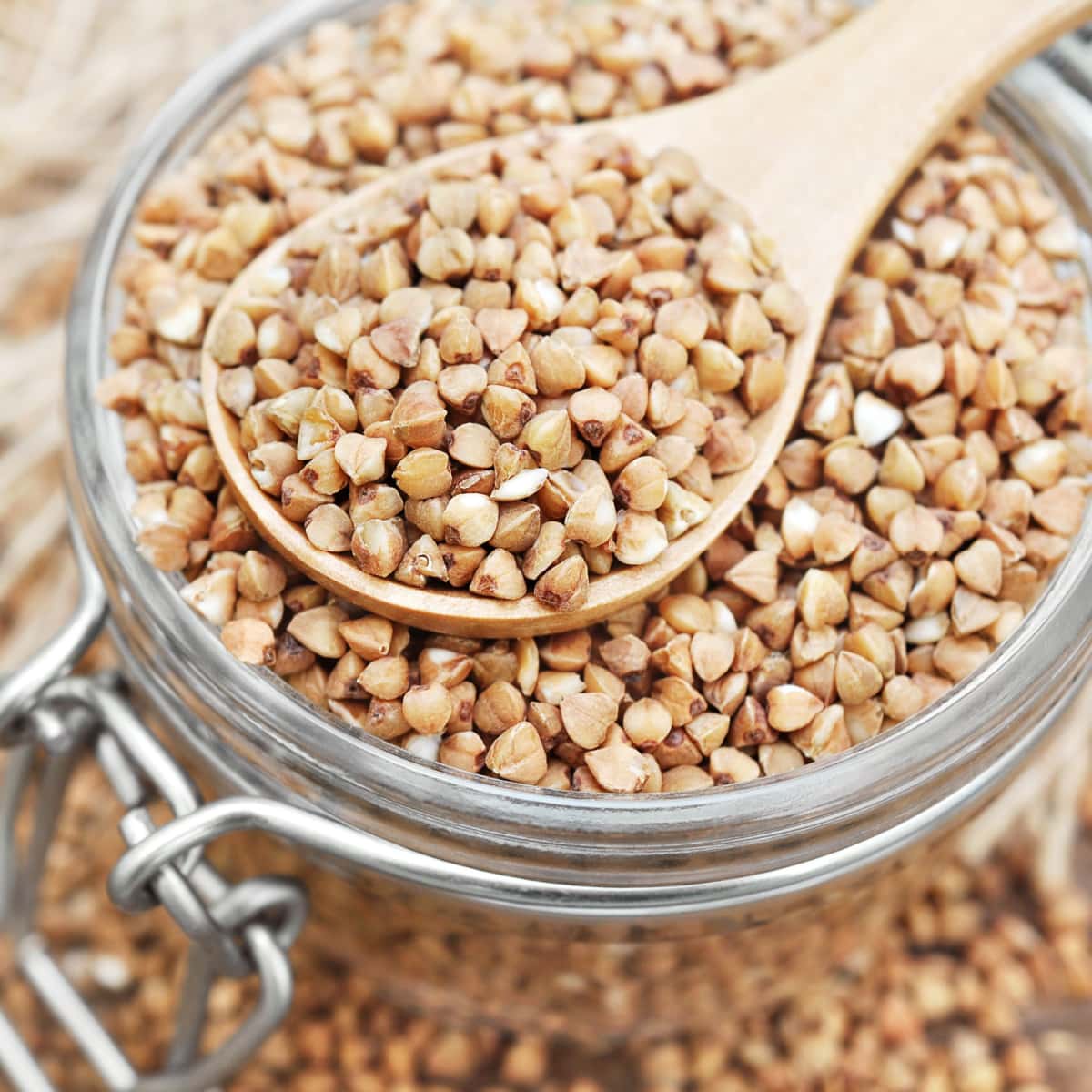 Wooden Spoon with Buckwheat on a Glass Container