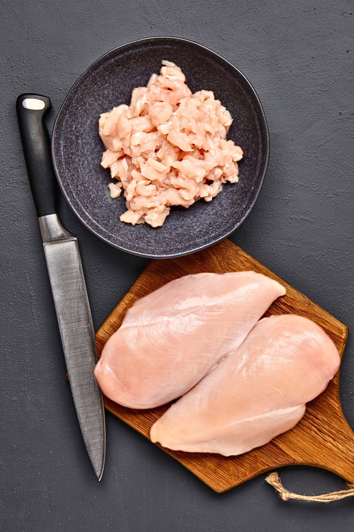 Knife and Raw Chicken Meat 