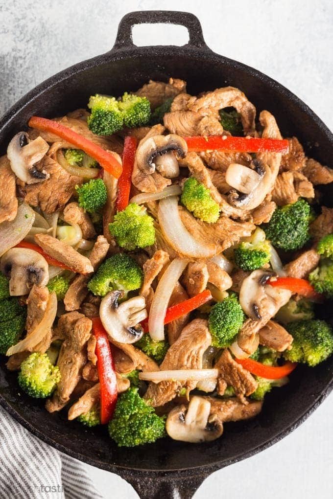 Stir-fry chicken on a skillet. 