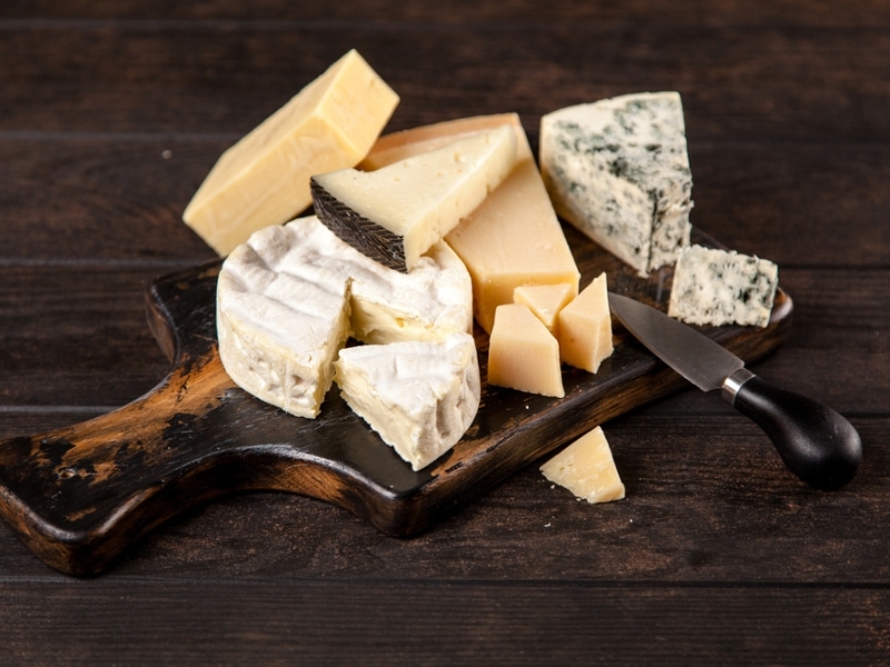 Different Cheese Types on a Wooden Board