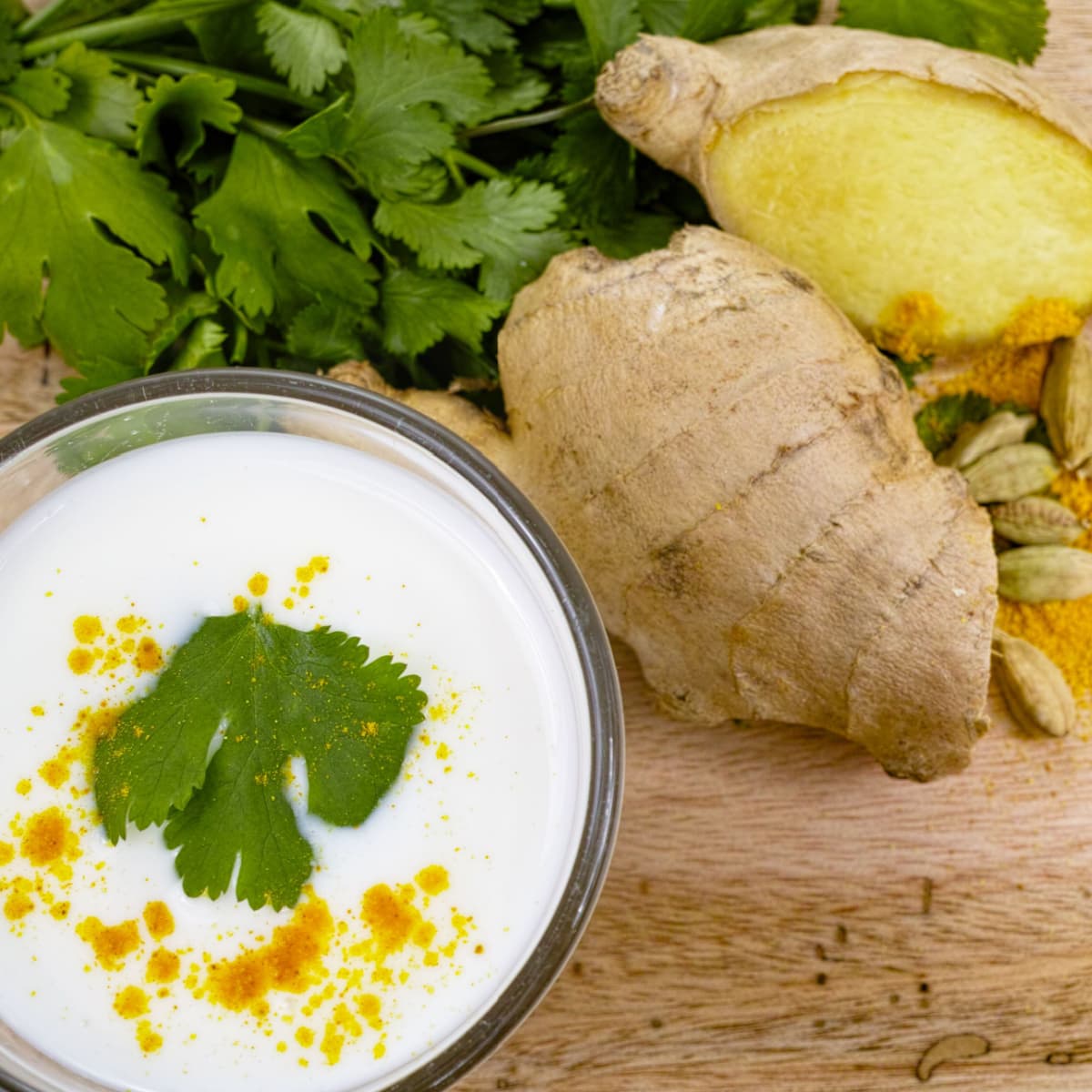 Fresh Ginger and Coriander on a Wooden Table