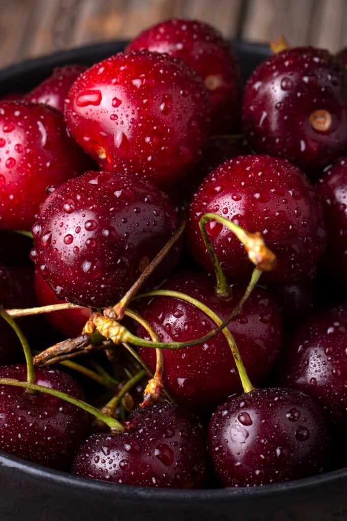 10 Best Summer Fruits To Try This Season featuring Fresh Organic Red Cherries with Water Droplets 
