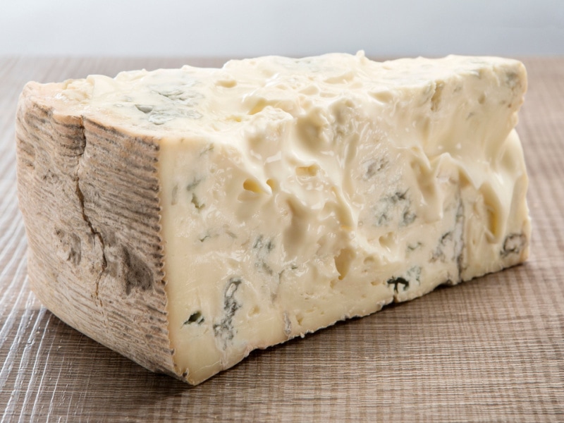 Slice of Gorgonzola Cheese on a Wooden Table