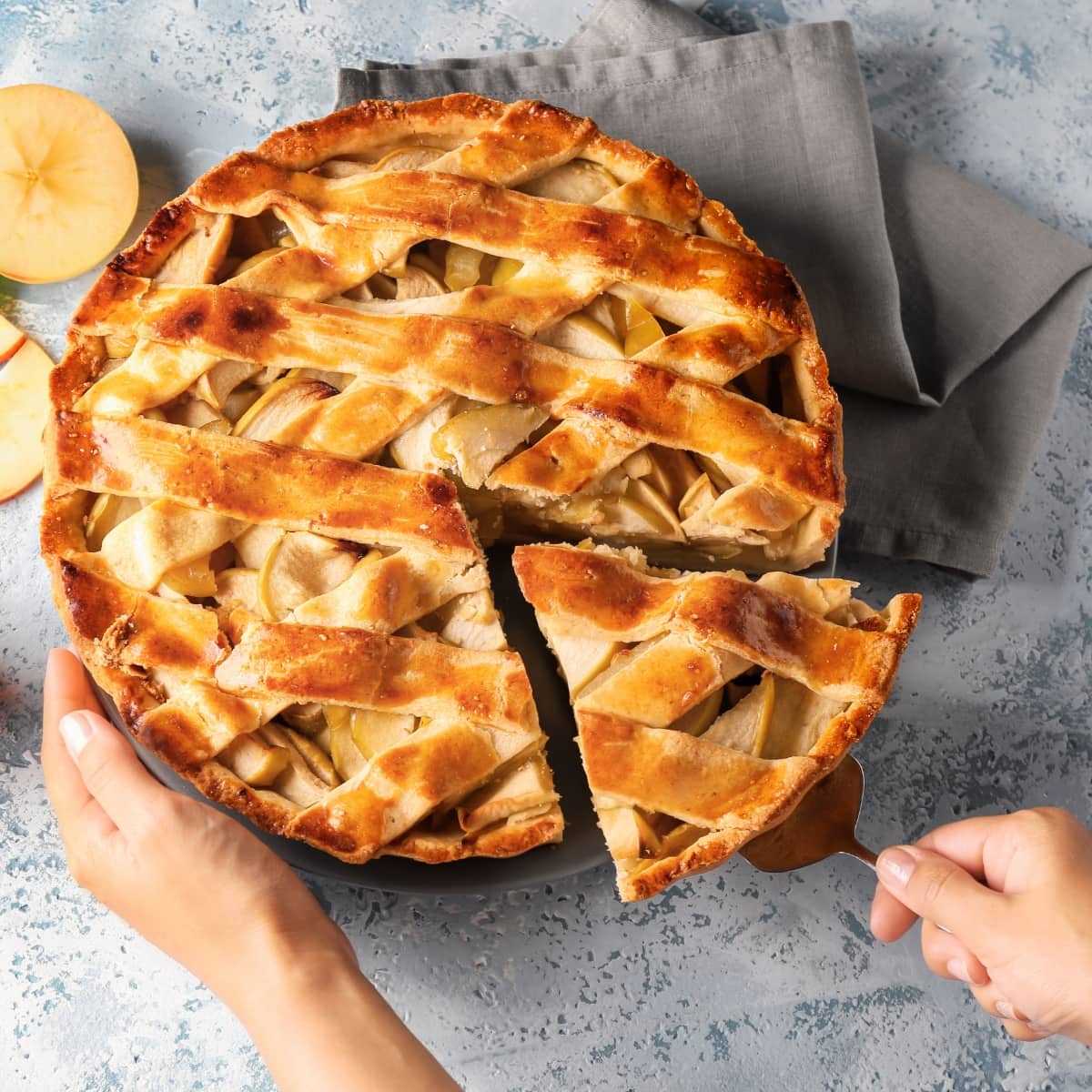 Woman Taking Piece Of Delicious Apple Pie From Plate By Using Pie Spatula