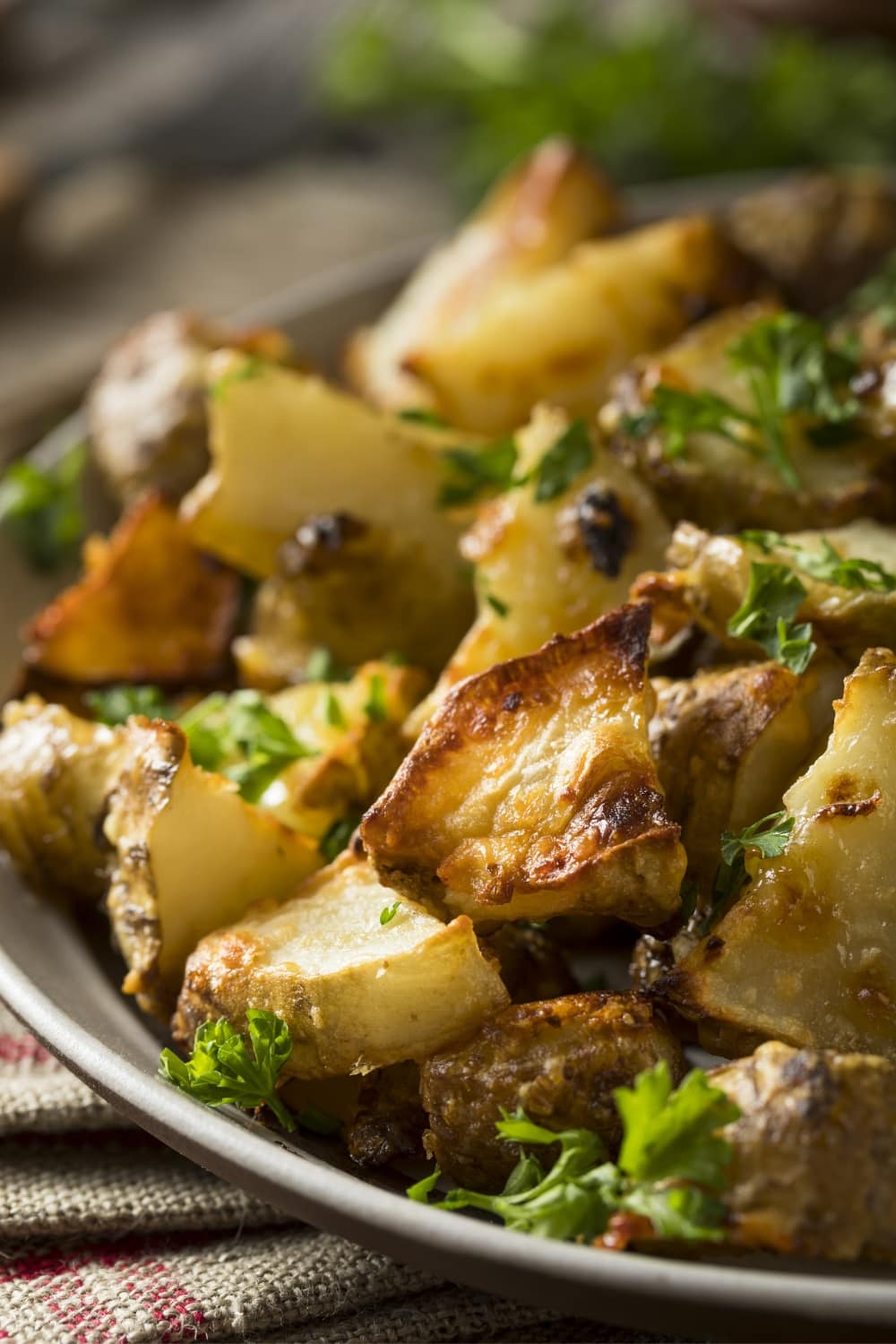 Closeup Roasted Sunchokes Served With Herbs and Spices
