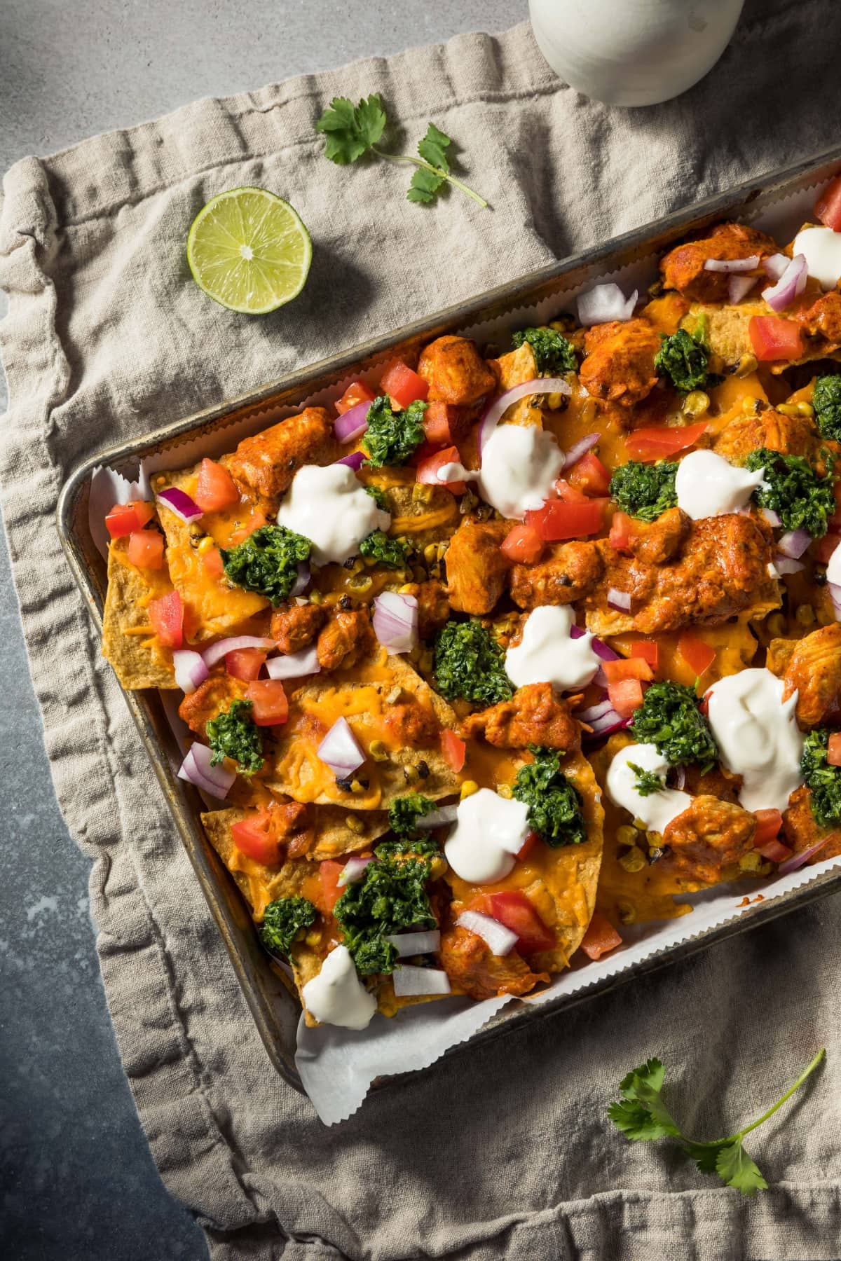 Homemade Chicken Nachos with Broccoli, Tomatoes and Onions