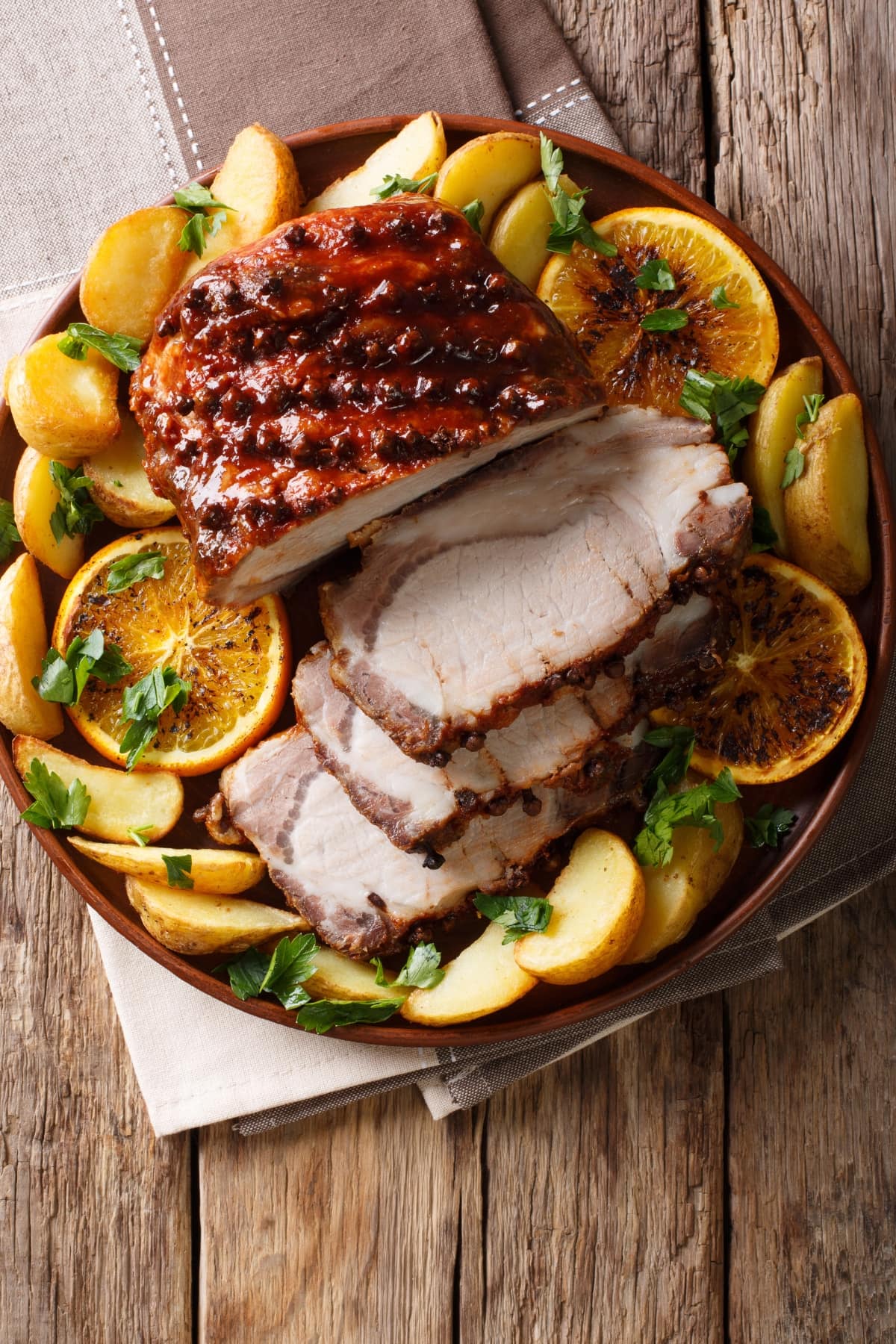 Homemade Christmas Baked Pork with Potatoes, Lemon and Apples