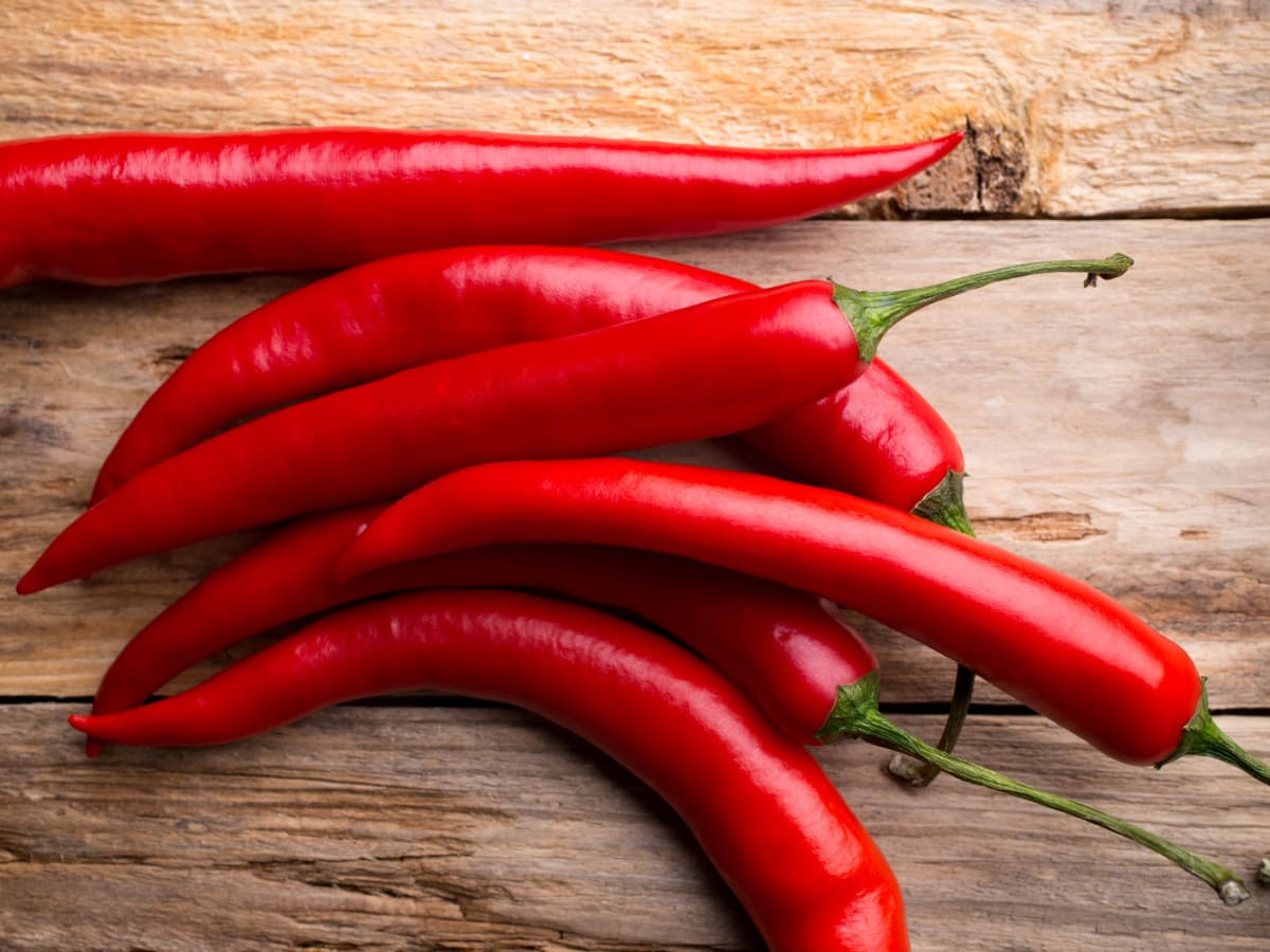 Fresh Red Chiles on a Wooden Table