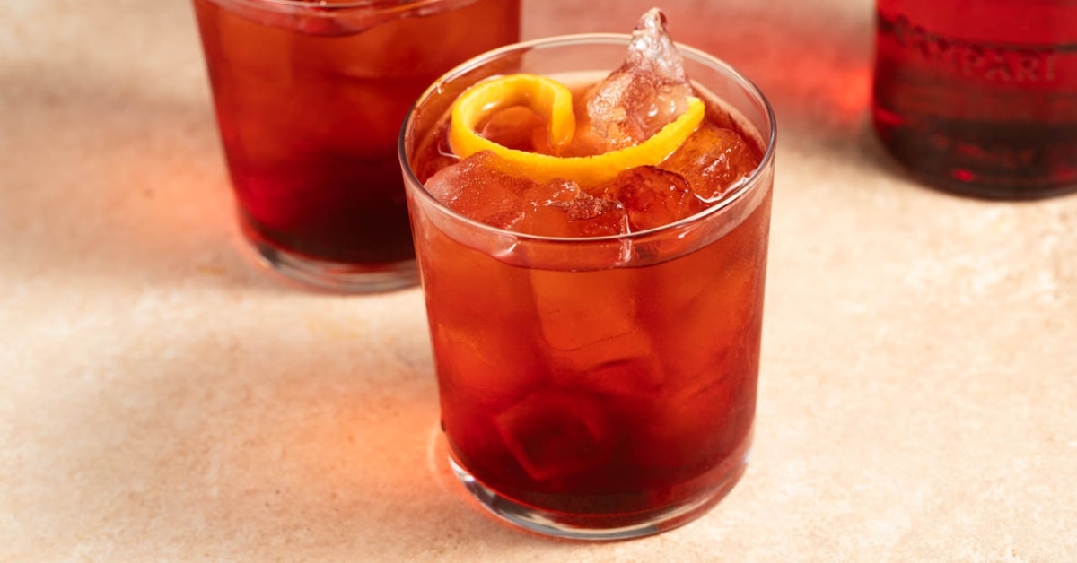 Negroni Sbagliato in a cold glass on a marble table