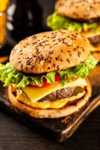 Homemade Hamburger with Tomatoes, Lettuce, Cheese and Sesame Seeds