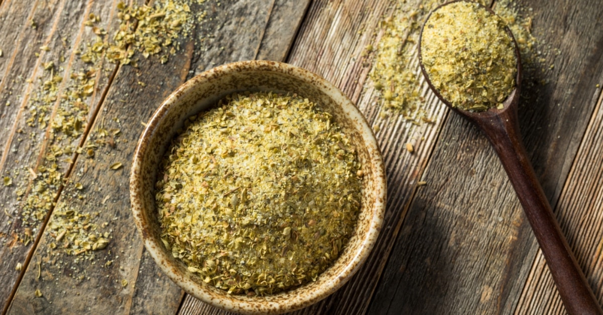 Organic Adobo Seasoning in a Bowl on a Wooden Board