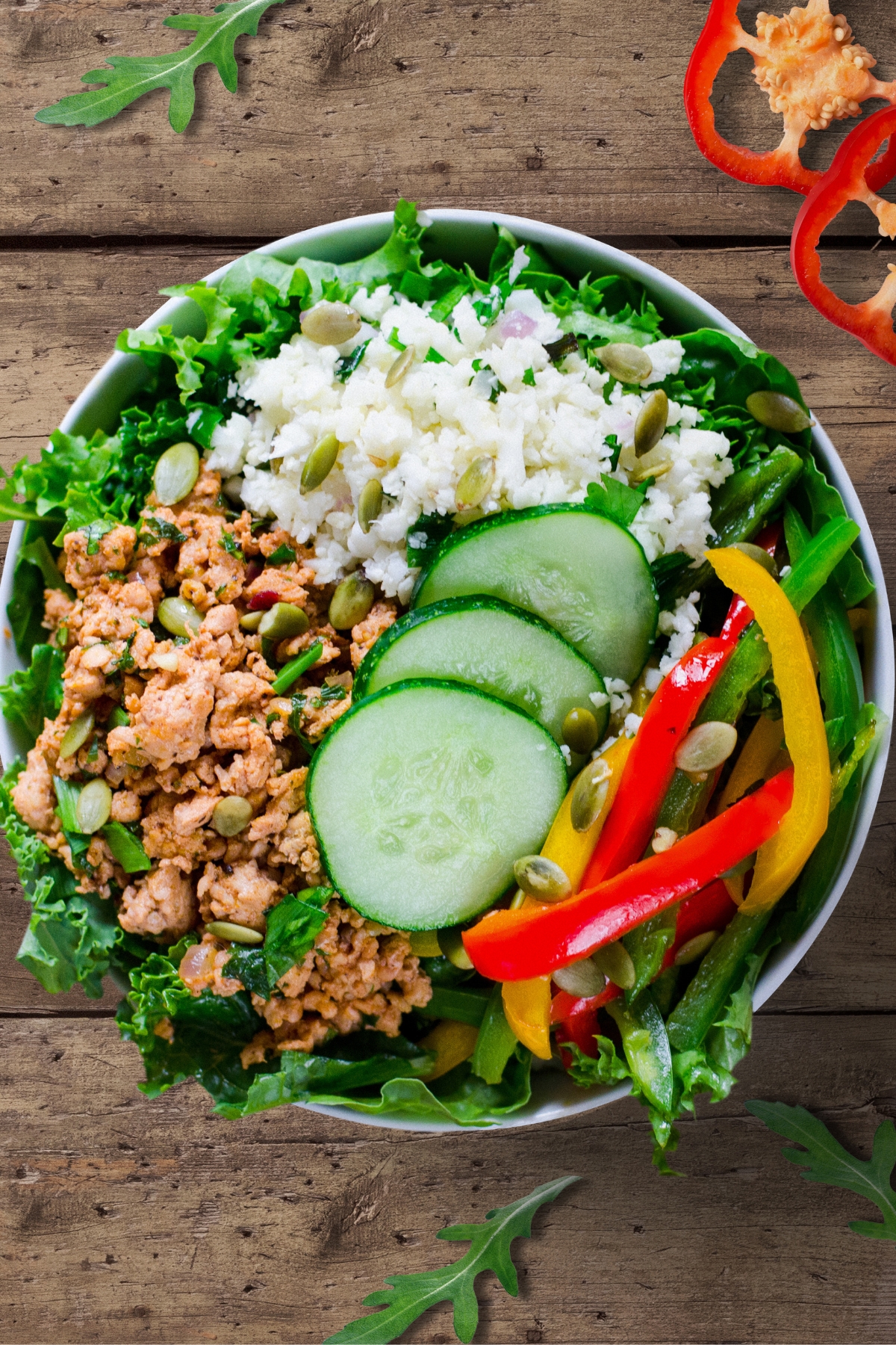 Keto Bowl with Ground Turkey, Cauliflower Rice, Paprikas, Cucumber, Kale and Pumpkin Seeds