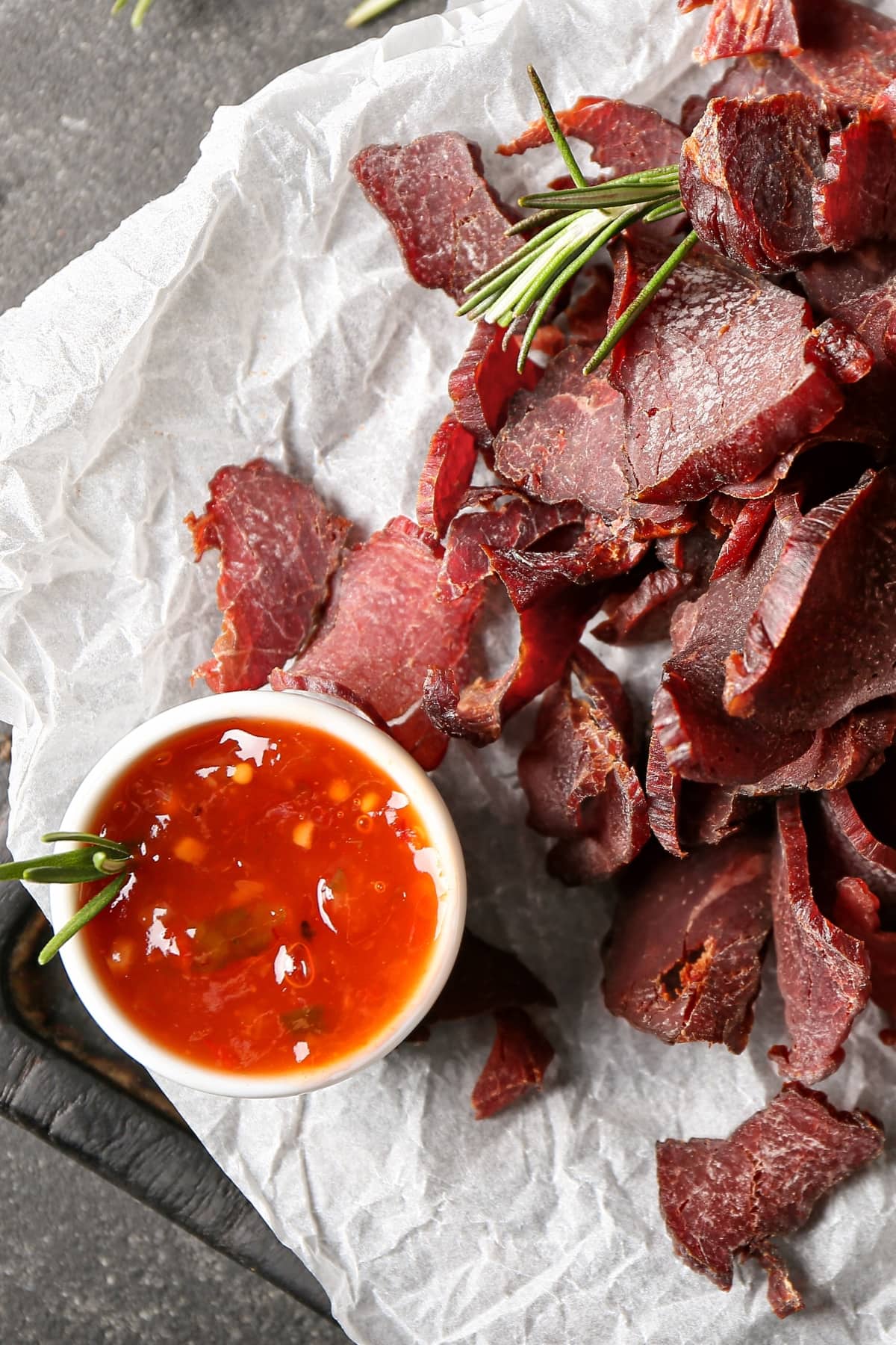 Spicy Beef Jerky with Sauce on a Parchment Paper