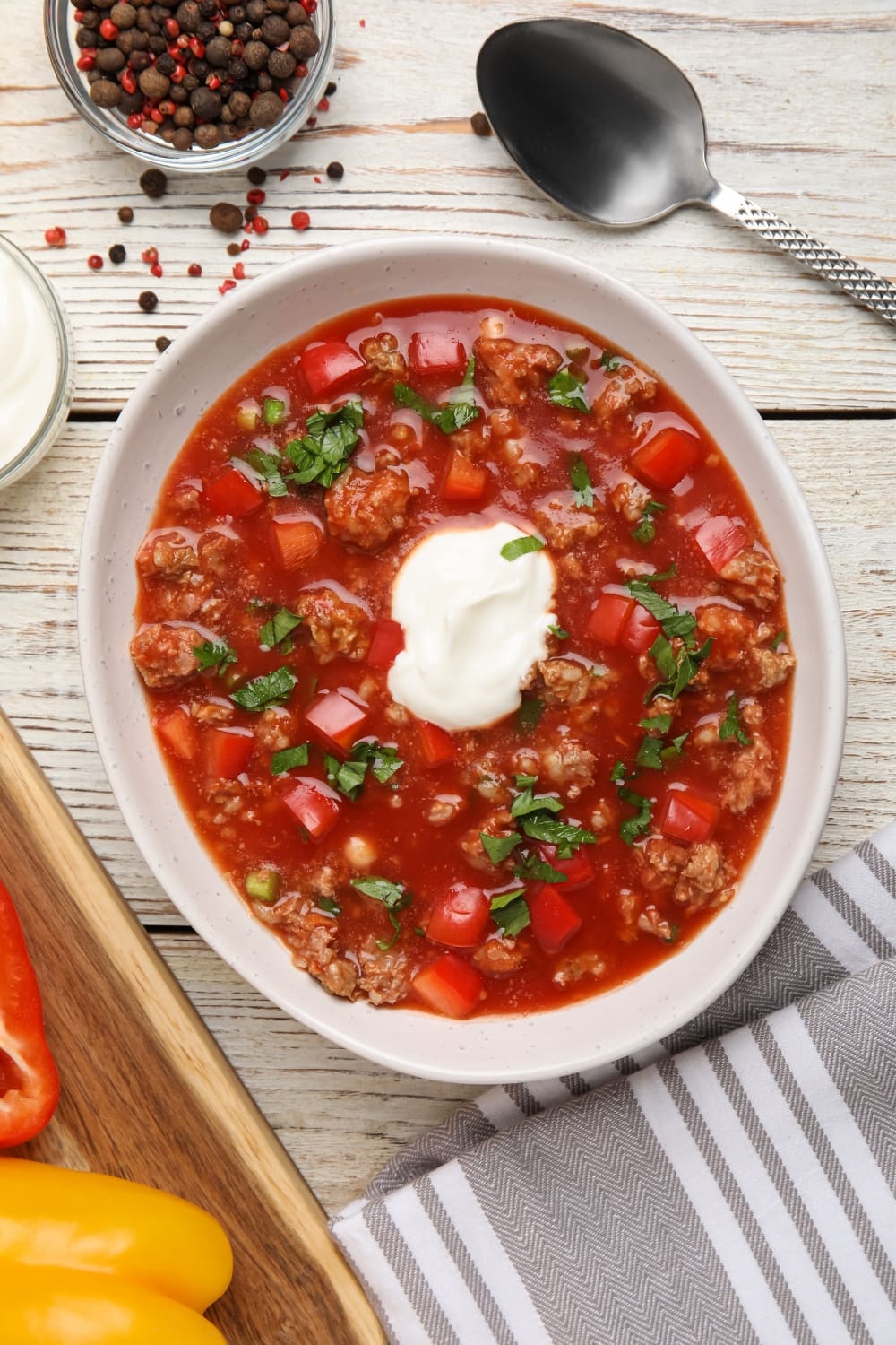 Bowl of Stuffed Pepper Soup Topped With Sour Cream 