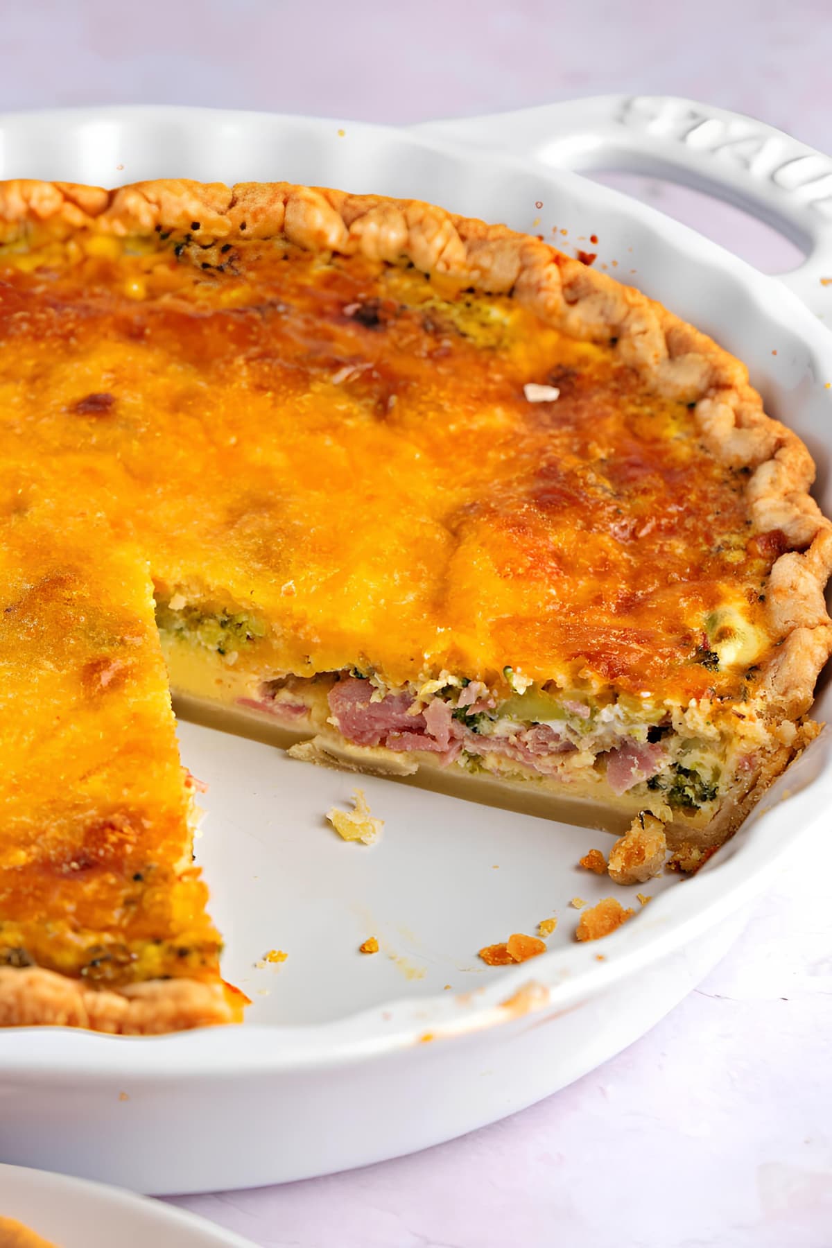 Broccoli Cheddar Quiche on a White Casserole