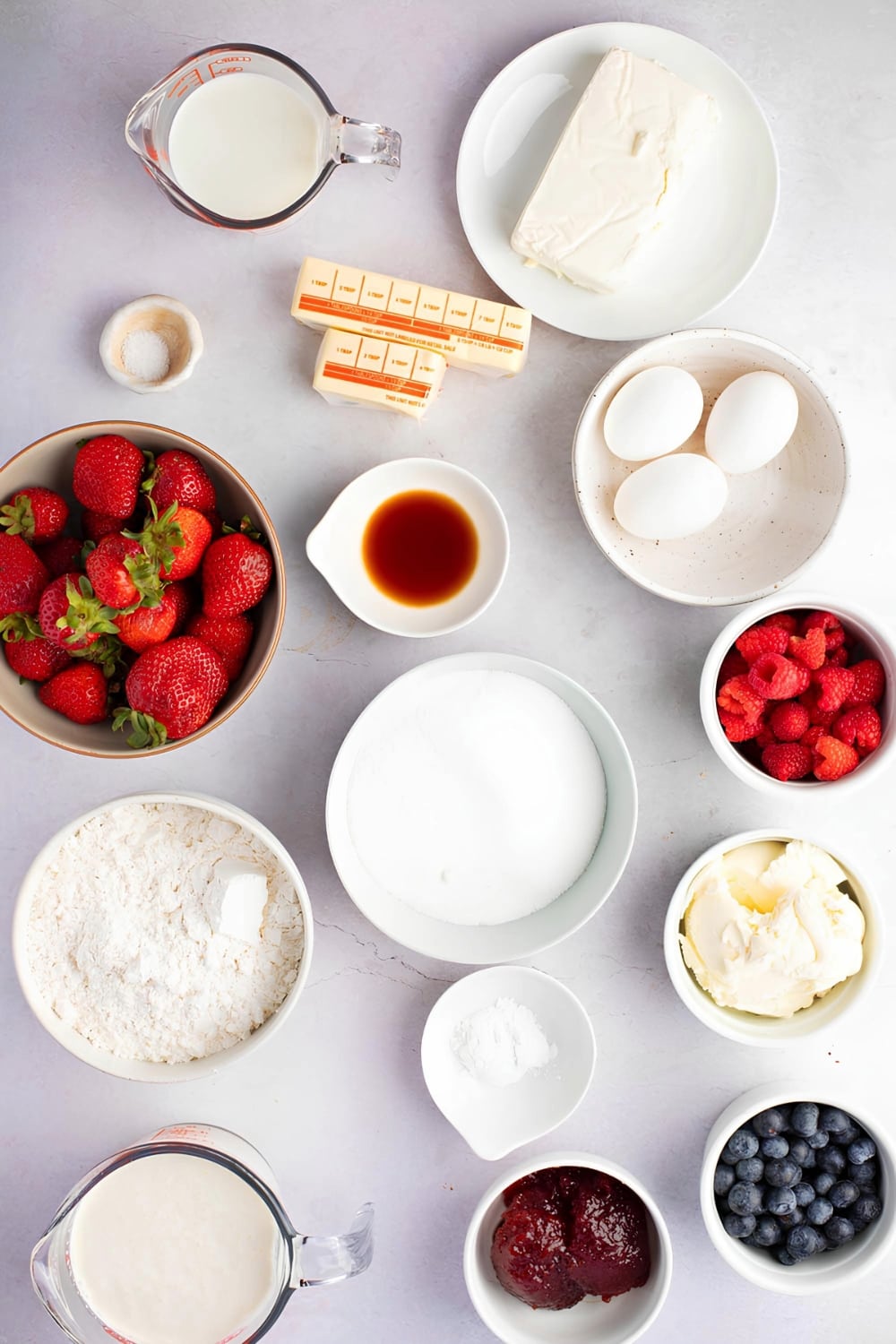 Chantilly Cake Ingredients on a White Marble Surface