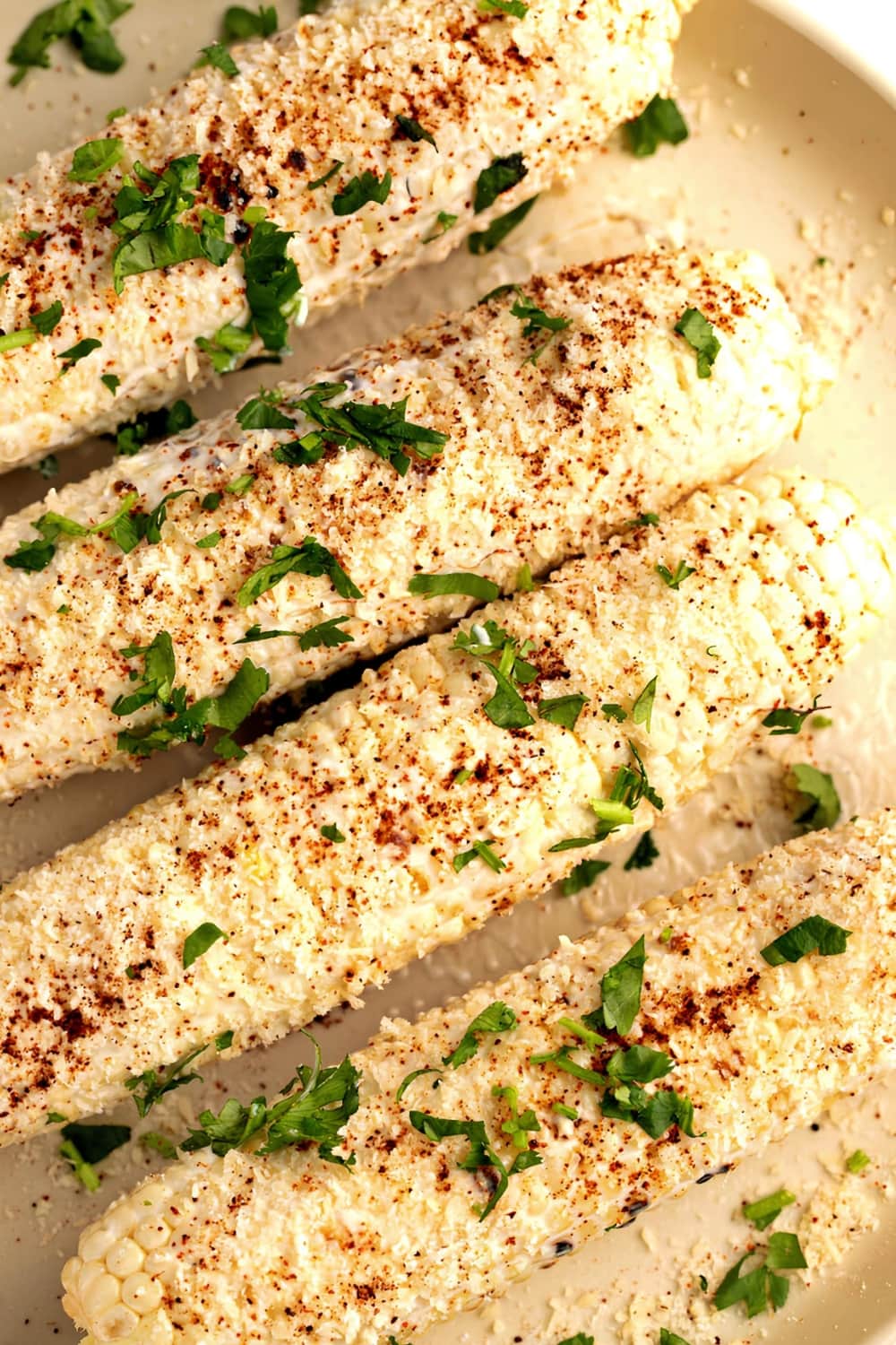 Grilled Mexican Street Corn with Cilantro and Cotija Cheese on Top