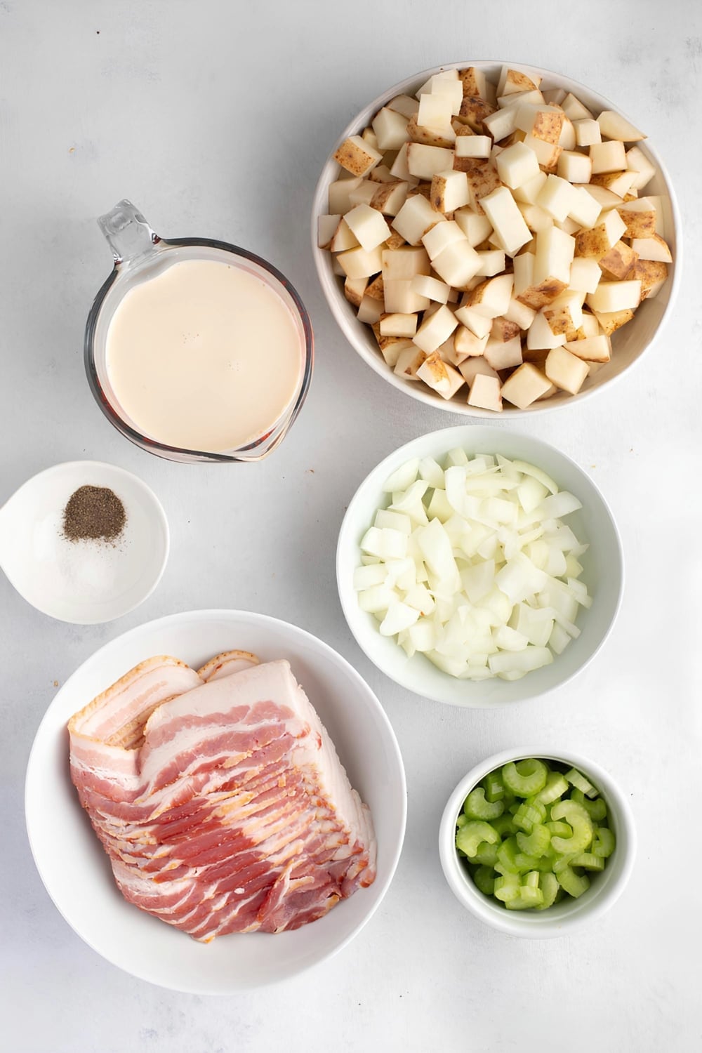 Irish Potato Soup Ingredients on a White Surface