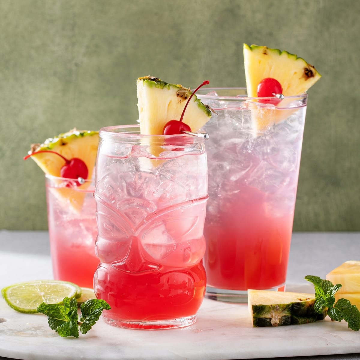 Refreshing Singapore Sling Cocktails Served in Three Different Glasses