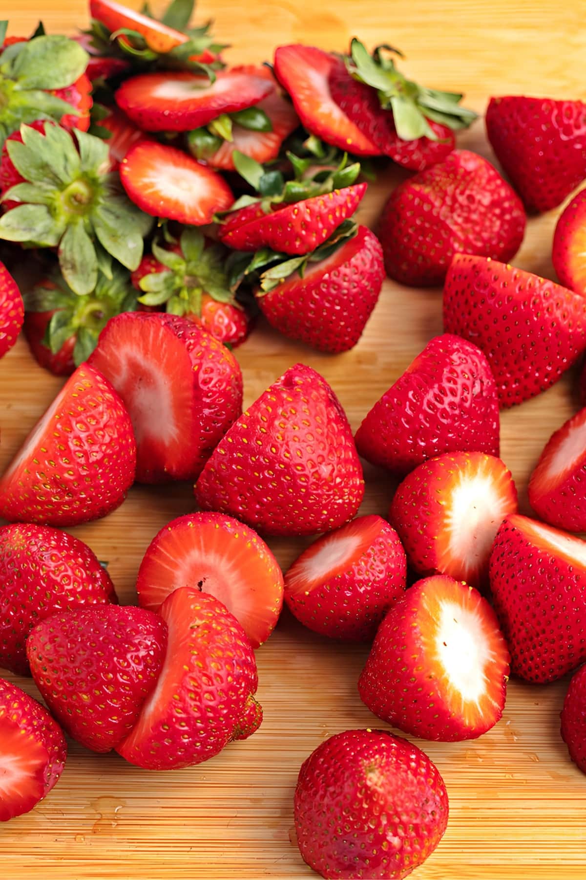 Sliced Strawberries on a Wooden Board