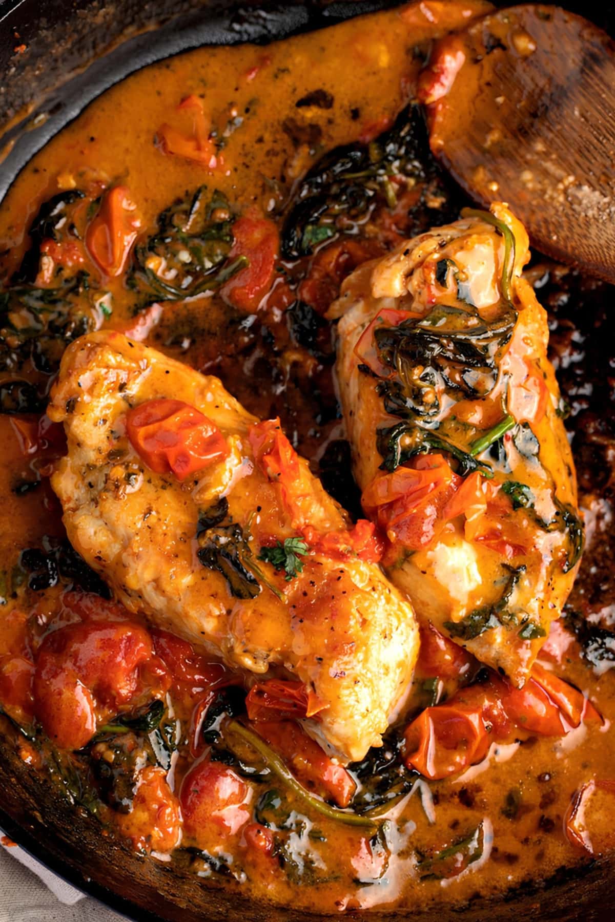 Tuscan Chicken cooked in an iron cast