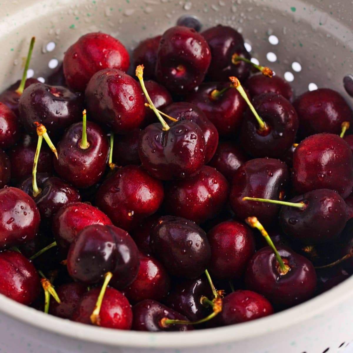 Washed fresh cherries in a colander 