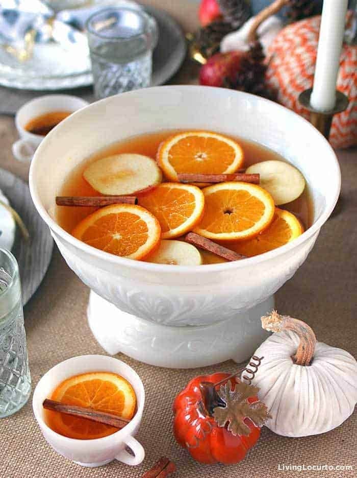 Autumn spice punch on a ceramic mug and punch bowl. 